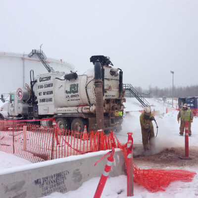 Hydro excavation at a winter construction site